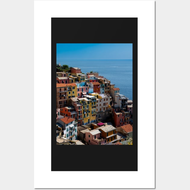 View on the cliff town of Manarola, one of the colorful Cinque Terre on the Italian west coast Wall Art by Dolfilms